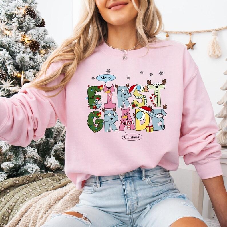 1st Grade Teacher Christmas Sweatshirt, Elephant And Piggie Christmas T-shirt, Santa's Favorite Teacher Shirt, First Grade Christmas Hoodie