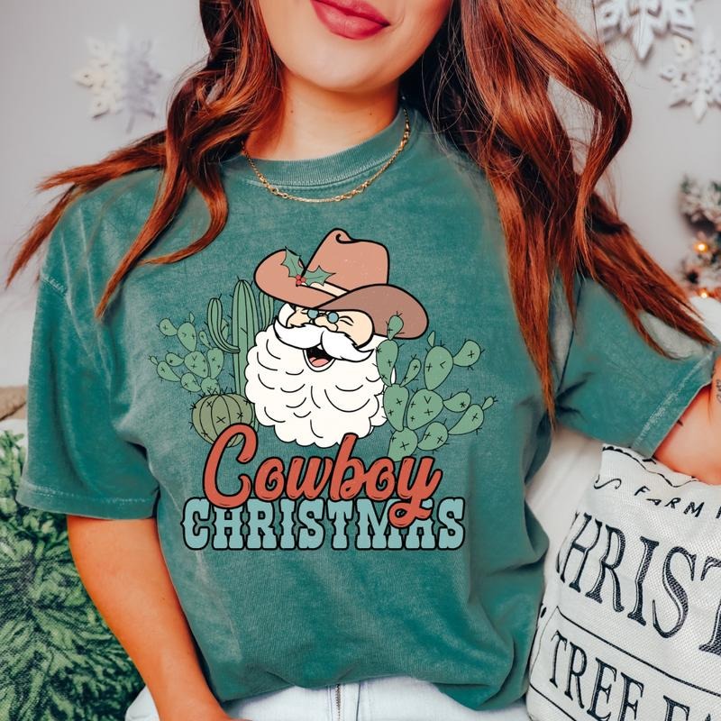 COWBOY CHRISTMAS SANTA T-SHIRT (COMFORT COLORS T-SHIRT, CASUAL SHIRT UNISEX, CHRISTMAS CLOTHING, GRAPHIC APPAREL, HOLIDAY SHIRT) Cotton Fabric