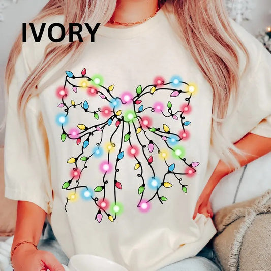 Christmas Lights Bow #3 Shirt, Christmas Bow Shirt, Christmas Coquette Bow (COMFORT COLORS T-SHIRT, CASUAL SHIRT UNISEX, CHRISTMAS CLOTHING, GRAPHIC APPAREL, HOLIDAY SHIRT) Cotton Fabric Womenswear Top Printed Oversized Women