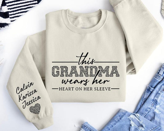 Custom Grandma Sweatshirt, This Grandma Wears Her Heart On Her Sleeve Sweater, With Kids Name On Sleeve, Grandma Sweater, Custom Grandma Gift