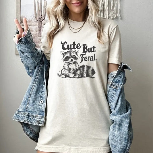 Cute But Feral T-Shirt, Funny Sarcastic T-shirt, Trendy Woman Shirt, Funny Raccoon Shirt, Humorous Shirt, Sarcastic Quote Shirt, Gift for Her, Unisex Cotton Shirt For Men And Women