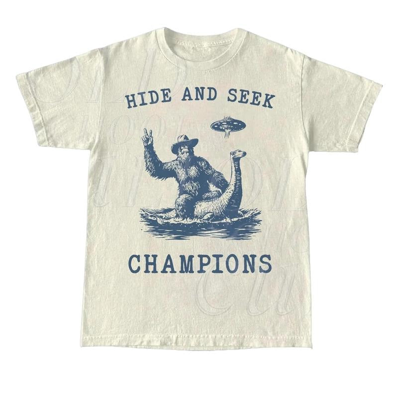 Hide And Seek UFO Shirt, Retro Bigfoot Shirt, Bigfoot Riding Dinosaur Shirt, Space Alien Unisex Relaxed Adult Graphic Tee, Funny Gifts Cotton Menswear