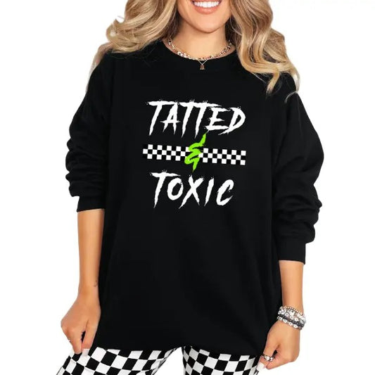 TATTED & TOXIC Black Sweatshirt/Hoodie | Grunge Inspired Goth Streetwear | Edgy Alternative Fashion | Bold Checkered Pattern Background | Perfect for Tattooed & Fierce Vibes | Trendy Oversized Look | Standout Style Streetwear Lovers | Must-Have Urban Gear