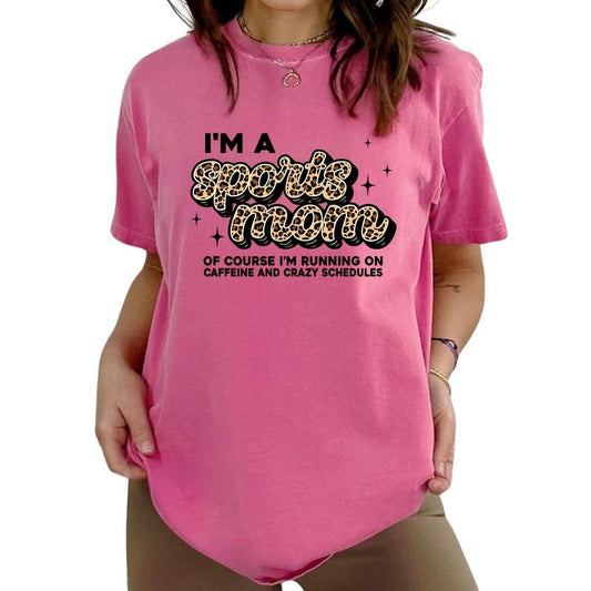 I'm A Sports Mom Of Course I'm Running On Caffeine And Crazy Schedules Tee, Funny Sports Mama Tour Graphic Tee Women, Funny Mom T-shirts, Oversized Graphic Tee, Mother's Day Gifts, Women's Tops, Womenswear, Cotton Fabric Relaxed Fit Chic Style