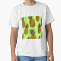Pineapples on light green background by imagenia